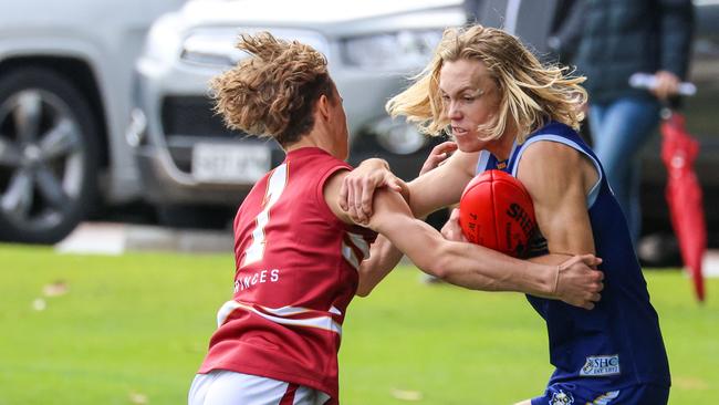 Sacred Heart’s Kobe Ryan in action against Prince Alfred’s Zac Bishop during college football’s round one. Sacred Heart claimed the victory. Picture: Russell Millard