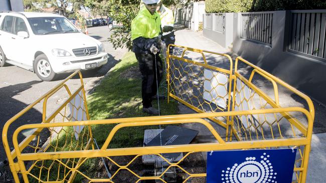 Contractors working on the rollout of the NBN network. Picture: AAP