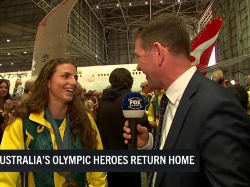 Record breaking Olympic team arrive home