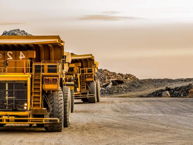 Dump Trucks transporting Platinum ore for processing