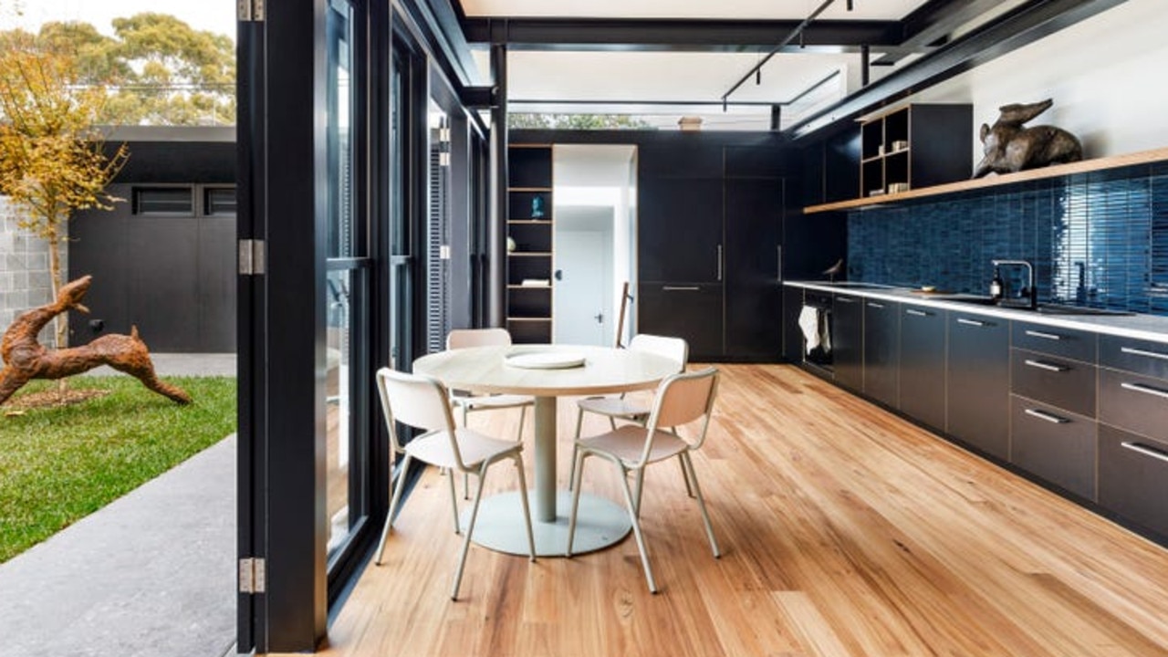 The kitchen area opens up into the backyard and the transformation of the kitchen. Picture: realestate.com.au