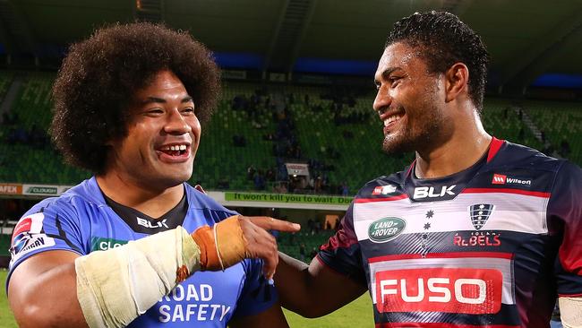 Wallabies hooker Tatafu Polota-Nau shares a laugh with Japan No 8 Amanaki Mafi.