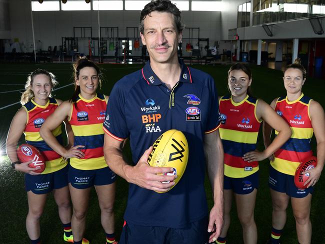 Crows AFLW coach Matthew Clarke, with players Nikki Gore, Jessica Sedunary, Ebony Marinoff and Courtney Cramey. Photo: Bianca De Marchi