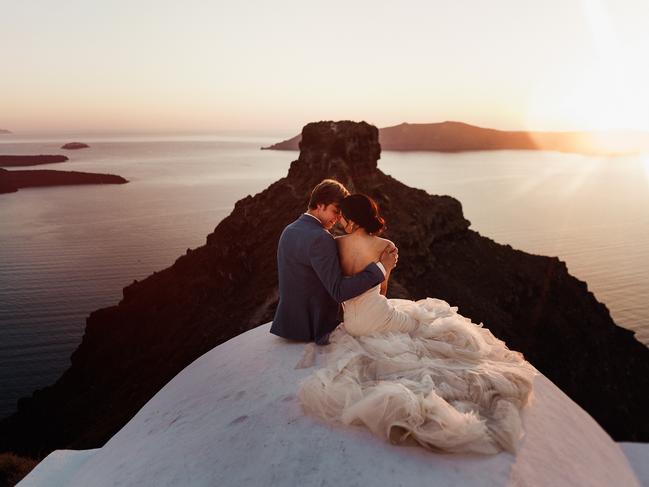 Roberto Panciatici photographed this couple sharing an intimate moment together in Santorini, Greece.