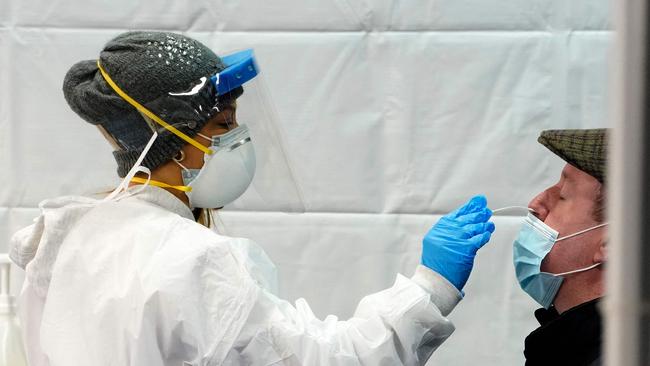 A man gets swabbed at a Covid-19 testing centre in New York’s Times Square on Tuesday. Picture: AFP