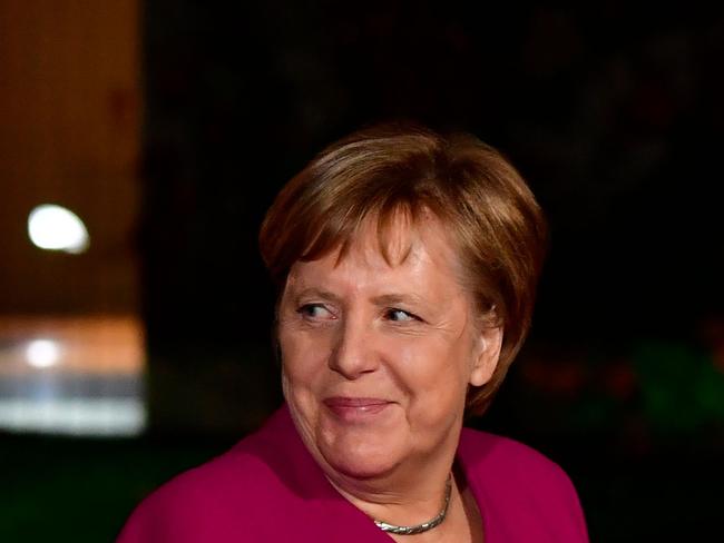 German Chancellor Angela Merkel looks on as she welcomes the South African President ahead of the 'Compact with Africa' conference in Berlin on October 29, 2018. (Photo by Tobias SCHWARZ / AFP)