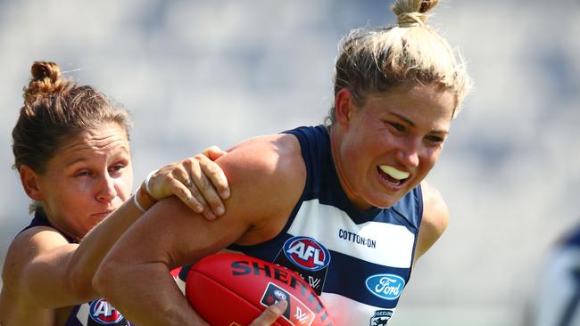 Geelong skipper Melissa Hickey tries to get away from Kiara Bowers. Pic: Getty Images