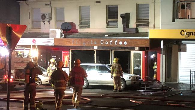 Fire crews at work during a fire at Pilgrim Coffee in Hobart's CBD. Picture: PHIL YOUNG