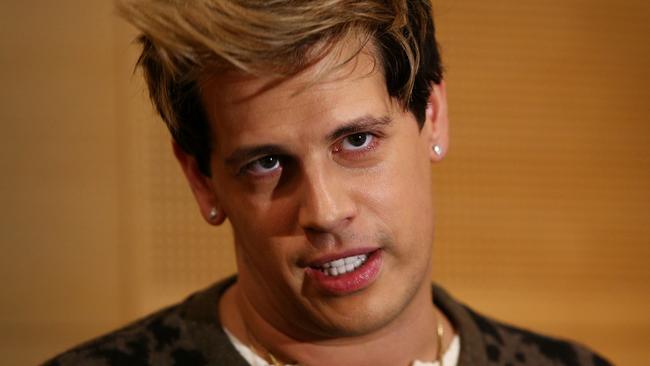 SYDNEY, AUSTRALIA - NOVEMBER 29:  Milo Yiannopoulos reacts during a press conference on arrival at the Sydney International Airport on November 29, 2017 in Sydney, Australia. Yiannopoulos is in Australia for his Troll Academy Tour.  (Photo by Lisa Maree Williams/Getty Images)