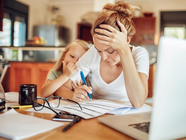 Close up of a mother going through her financials