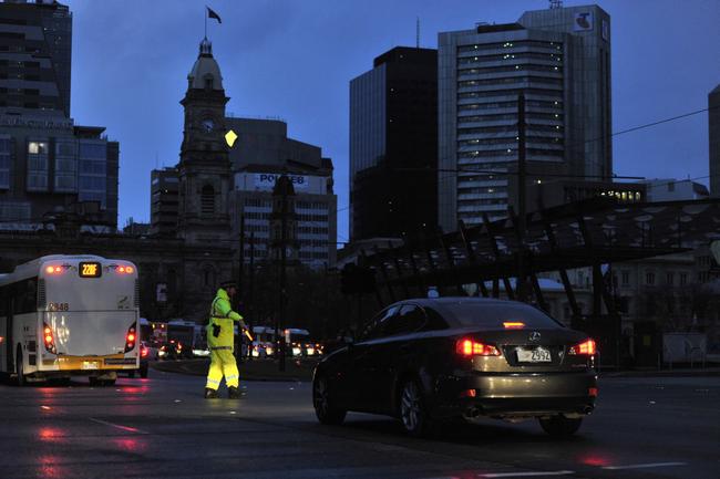 Police direct traffic around the CBD in Adelaide after the power network stops working. Wednesday September, 28, 2016. (AAP Image/David Mariuz) NO ARCHIVING. Picture: DAVID MARIUZ