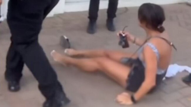 The security guard shoved her back, causing her to fall. Picture: Channel 7