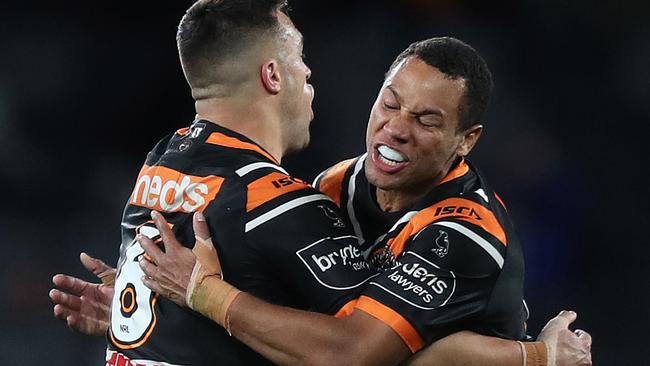 Tigers Luke Brooks celebrates with Tigers Moses Mbye after kicking the winning field goal during the Wests Tigers v Bulldogs NRL match at Bankwest Stadium, Parramatta. Picture: Brett Costello