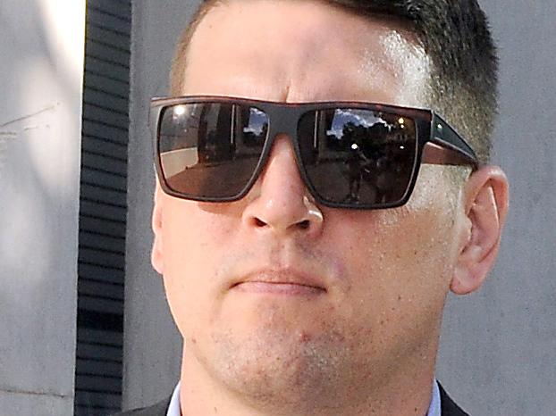 Brisbane, AUSTRALIA - NewsWire Photos February 22, 2021: Brisbane cop Matthew Paul Hockley who is standing trial for allegedly grooming a child under 16 leaves Brisbane Supreme Court.Picture: NewsWire / John Gass