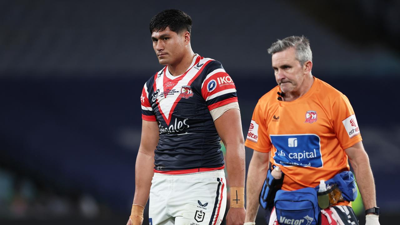 De La Salle Va'a of the Roosters leaves the field for a HIA during the round 27 NRL match between South Sydney Rabbitohs and Sydney Roosters. Photo: Matt King/Getty Images