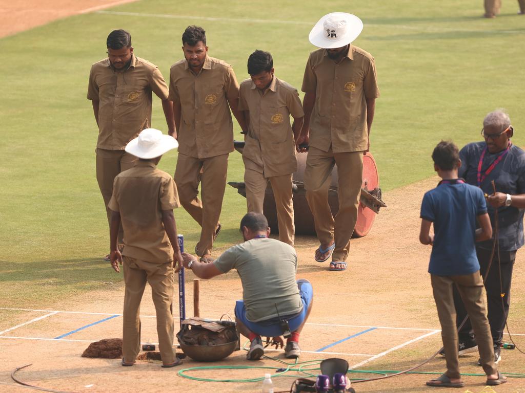 Indian officials the pitch for the semi-final against New Zealand. Picture: Getty Images