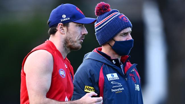 Michael Hibberd speaks to Simon Goodwin at training. Picture: Getty Images