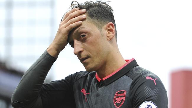 Arsenal's Mesut Ozil leaves the pitch.