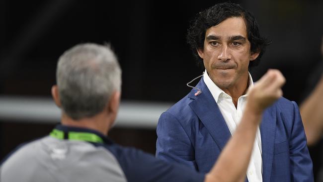 Club legend Johnathan Thurston speaks to Cowboys coach Paul Green before the start of Thursday night’s match between North Queensland and Sydney Roosters. Picture: Getty Images