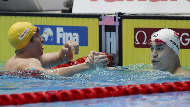 China's Sun Yang, right, is congratulated by Australia's Jack McLoughlin. Picture: AP