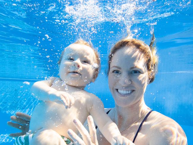 Olympic swimming champion Emily Seebohm swimming with son Sampson at Centenary Pool in Spring Hill. Picture Lachie Millard