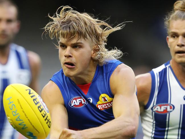 Marsh community Cup. Western Bulldogs v North Melbourne at Marvel Stadium.  21/02/2020.  Bailey Smith of the Bulldogs clears by hand q1   . Pic: Michael Klein
