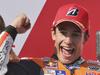 MotoGP rider Marc Marquez of Spain pumps his fist as he celebrates winning the Australian Motorcycle Grand Prix at Phillip Island, Australia, Sunday, Oct. 18, 2015. Marquez took the checkered flag ahead of MotoGP rider Jorge Lorenzo of Spain, and MotoGP rider Andrea Iannone of Italy.(AP Photo/Rob Griffith)