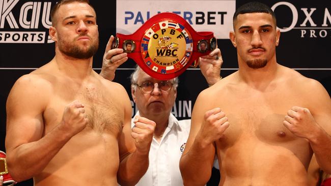 Justis Huni (right) and Joseph Goodall face off during the weigh in ahead of their heavyweight bout in Brisbane. Picture: Chris Hyde/Getty Images