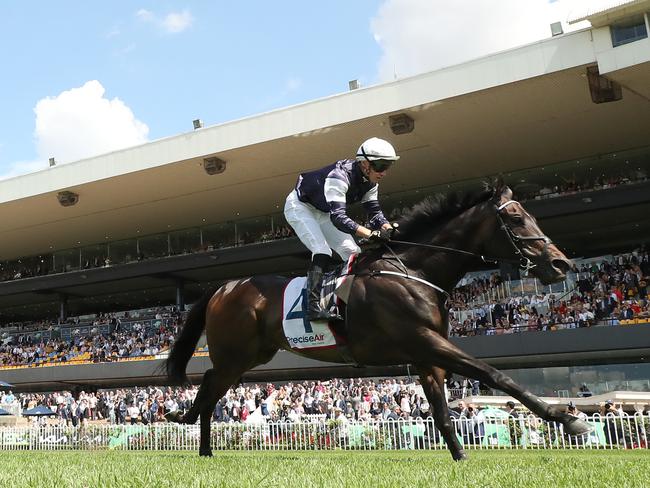 SYDNEY, AUSTRALIA - MARCH 23: Tom Marquand riding Post Impressionist wins Race 2 Precise Air N E Manion Cup during the Golden Slipper Day - Sydney Racing at Rosehill Gardens on March 23, 2024 in Sydney, Australia. (Photo by Jeremy Ng/Getty Images)