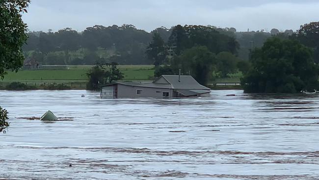 A house in West Taree was swept away in floodwaters on Saturday after heavy rain battered the area. Picture: Robert Cribb / Severe Weather Australia