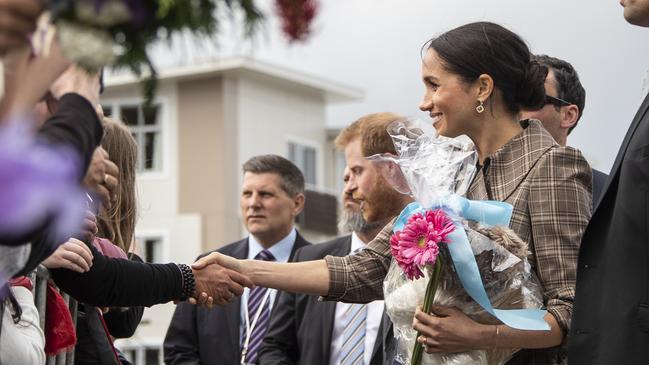 Meghan greets the crowd at the newly unveiled UK war memorial in Wellington, New Zealand. Picture: Getty Images