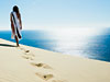 Woman at Carlo Sand Blow/Tourism Queensland