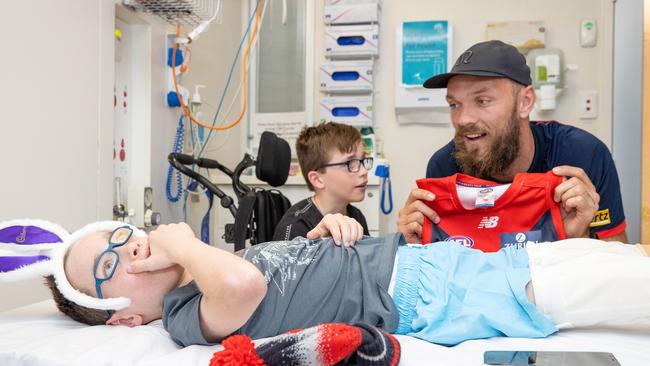 Finley Roche, 9, who recently underwent surgery at the RCH, is a huge Demons fan. On Good Friday he met footy star Max Gawn. Picture: Mark Stewart