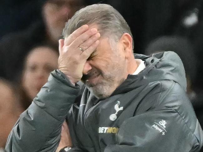 The score at 3-6, Tottenham Hotspur's Greek-Australian Head Coach Ange Postecoglou reacts on the touchline during the English Premier League football match between Tottenham Hotspur and Liverpool at the Tottenham Hotspur Stadium in London, on December 22, 2024. (Photo by Glyn KIRK / AFP) / RESTRICTED TO EDITORIAL USE. No use with unauthorized audio, video, data, fixture lists, club/league logos or 'live' services. Online in-match use limited to 120 images. An additional 40 images may be used in extra time. No video emulation. Social media in-match use limited to 120 images. An additional 40 images may be used in extra time. No use in betting publications, games or single club/league/player publications. /