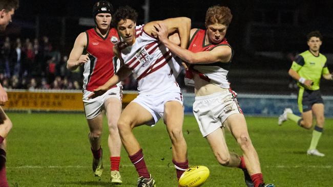 Adelaide Next Generation Academy prospect James Borlase, left, playing for Prince Alfred College against Henley in 2019. Picture: MATT LOXTON