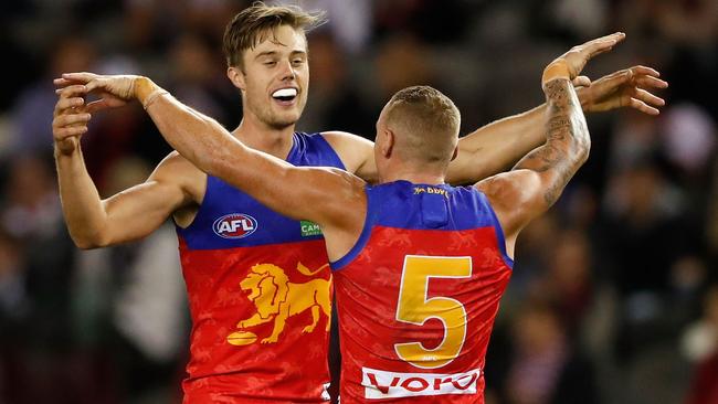 Josh Schache celebrates a goal with Mitch Robinson.