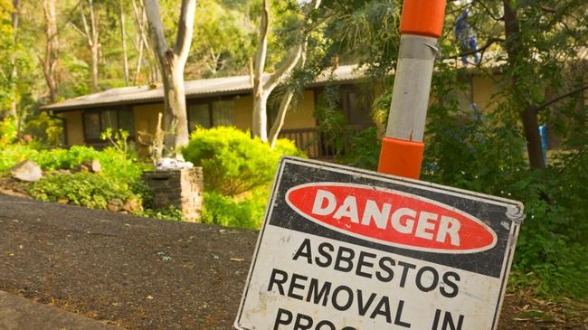 Generic asbestos removal sign outside a home containing the material. Picture: Asbestos Awareness