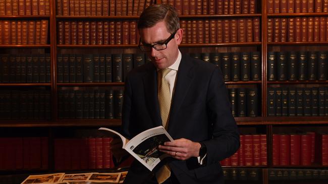 NSW Treasurer Dominic Perrottet looks over the 2019/20 budget papers in Sydney.