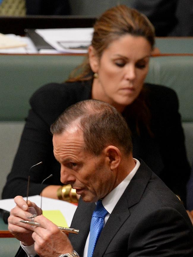 Tony Abbott walks past chief of staff Peta Credlin during Question Time in 2016.