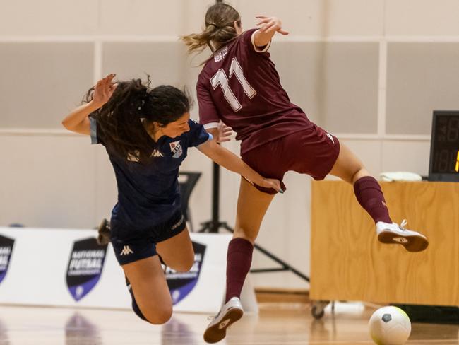 Legs flying everwhere in this Queensland v Victoria girls clash.