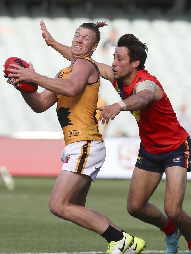 Kaine Stevens attempts to tackle WAFL’s Rhys Palmer. Picture Sarah Reed