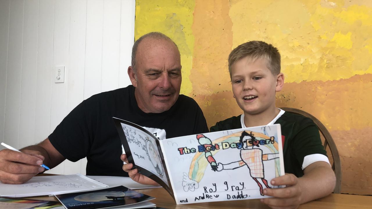 Children's author and Littlescribe ambassador Andrew Daddo enjoys a selection of stories with Archie Isaac, son of founder Jenny Atkinson. Picture: supplied.