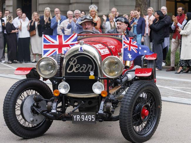 Re-enacting the journey from London to Melbourne originally undertaken in 1927 by Australian adventurer Francis Birtles, Daily Telegraph cartoonist Warren Brown and editor-at-large Matthew Benns are waved off outside Australia House, London. Picture: Jamie Lorriman