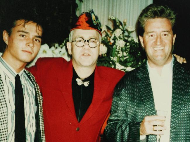 Undated copy photo of Ikin's partner Alex Despallieres (L), singer Elton John and music executive Peter Ikin.