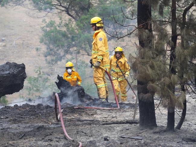 Fire fighters mop up hot spots in the bushfire area north of Beaufort. Picture: David Crosling