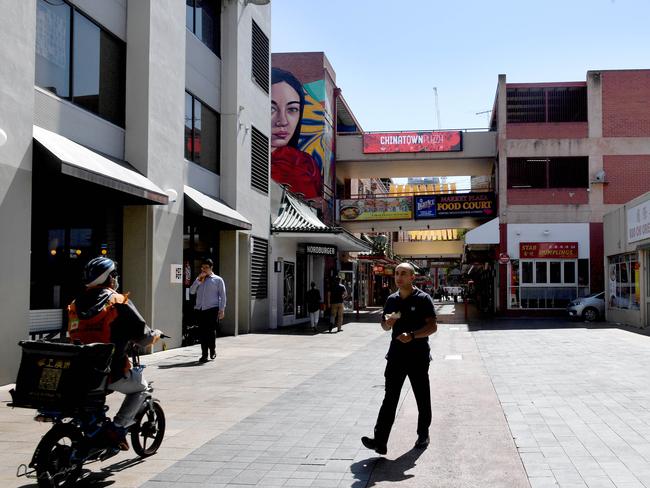 1pm. A few people wander around one the city’s premier eating hubs where restaurants would usually be packed with the weekday lunch crowd. Picture: Tricia Watkinson