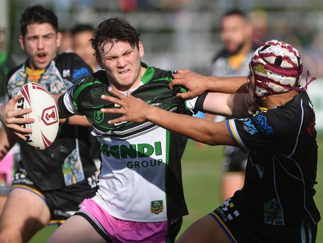 Townsville Blackhawks Edward Hampson powers past Magpies Denzel Samoza to score try on Queensland Cup debut. Picture: Evan Morgan