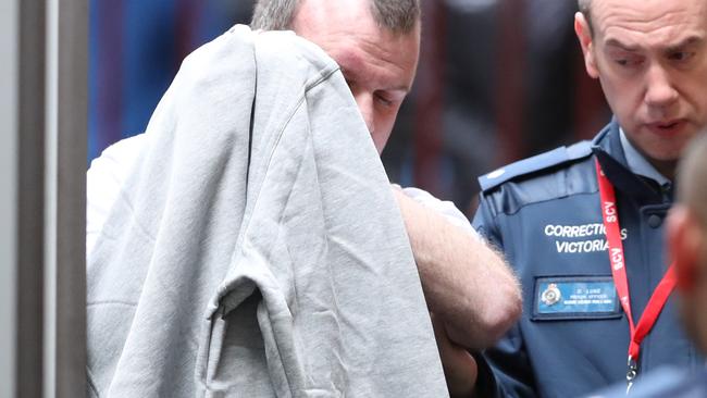 Scott Murdoch is taken into the Victorian Supreme Court in Melbourne in August.