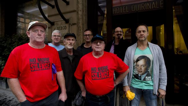 Survivors and relatives (L-R) Dominic Ridsdale, Phil Nagle, Paul Auchettl, David Ridsdale, Tony Waroley, Stephen Woods and Peter Blenkiron in front Hotel Quirinale in Rome. Picture: Alessandra Tarantino/AP