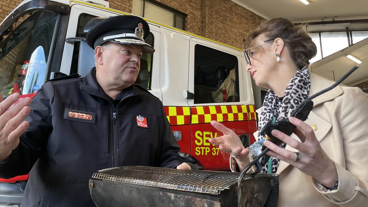 NSW Fire and Rescue Commissioner Paul Baxter and Emergency Services and Resilience Minister Steph Cooke survey a burnt heater at Wentworthville fire station.